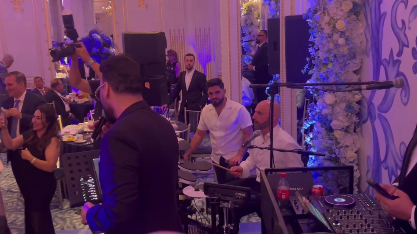 Live band performance at a wedding reception with full PA setup